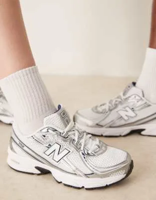New Balance 740 trainers in navy and white