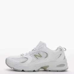 New Balance 530 trainers in white and light green